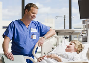 Male nurse speaking with patient Male nurse speaking with patient