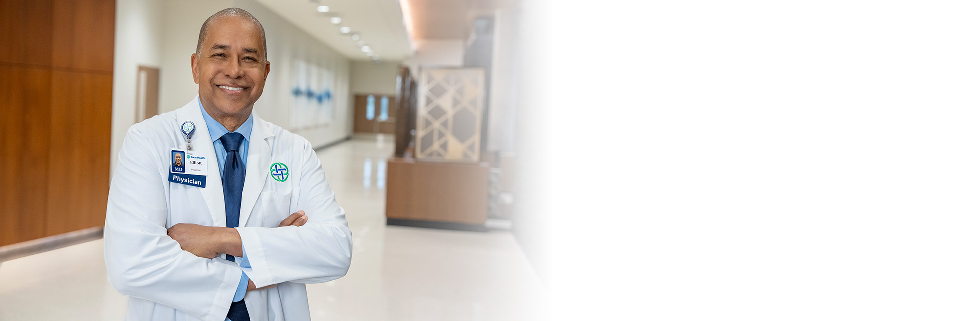 Physician standing in a hospital hallway