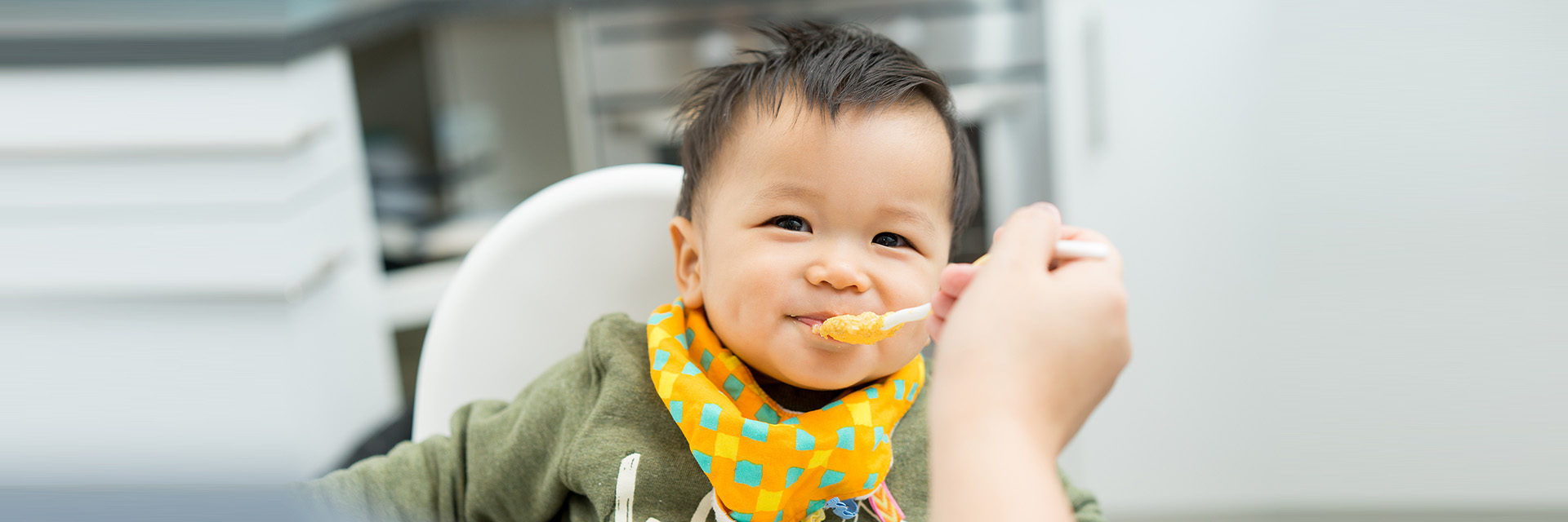 Baby eating solid food
