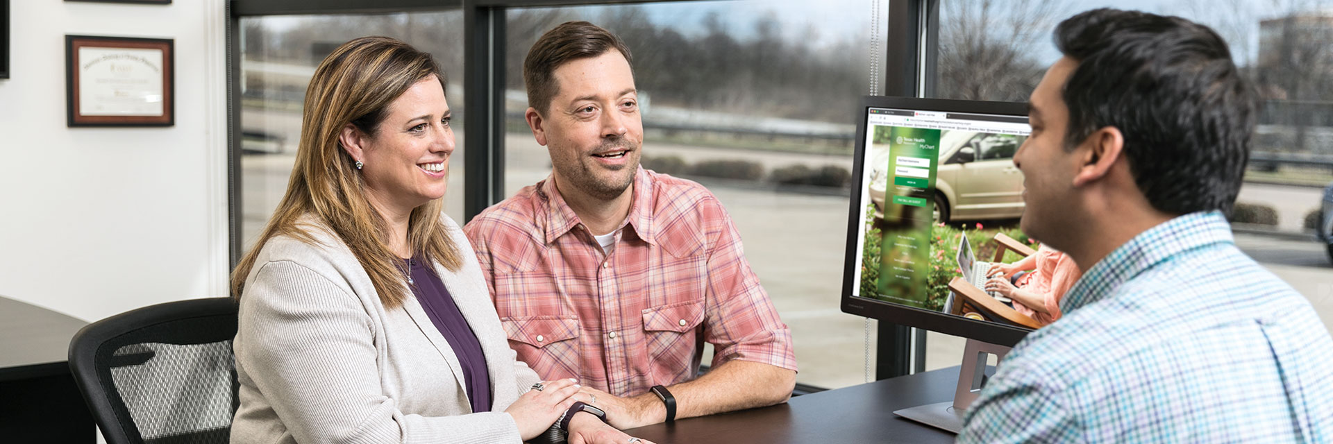 Couple Consulting with Doctor in Office
