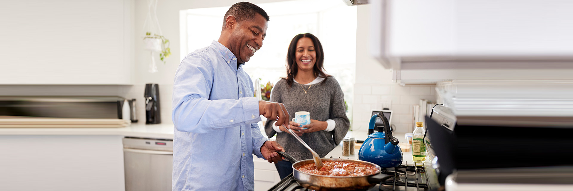 Couple cooking in kitchen