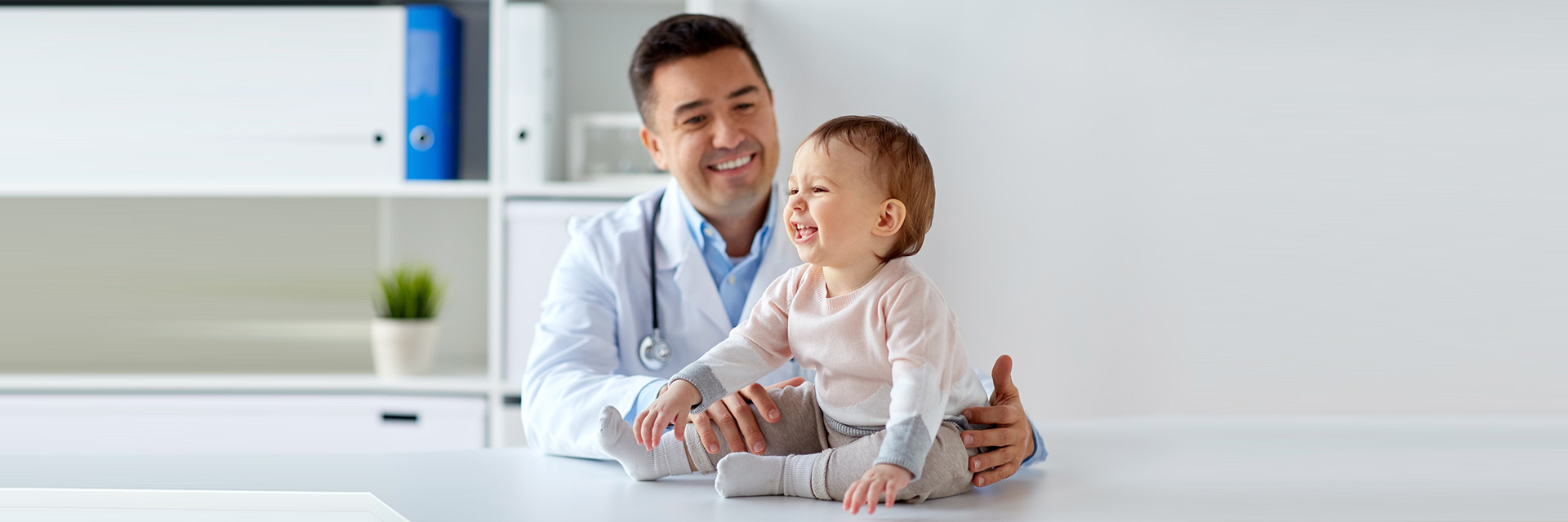 Doctor playing with baby