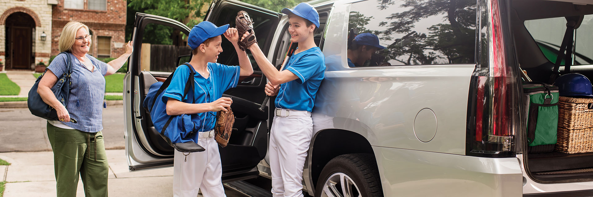 Mom taking sons to baseball game