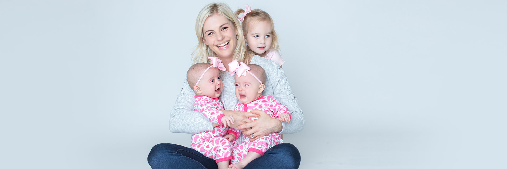 Mom with infant twins and sibling