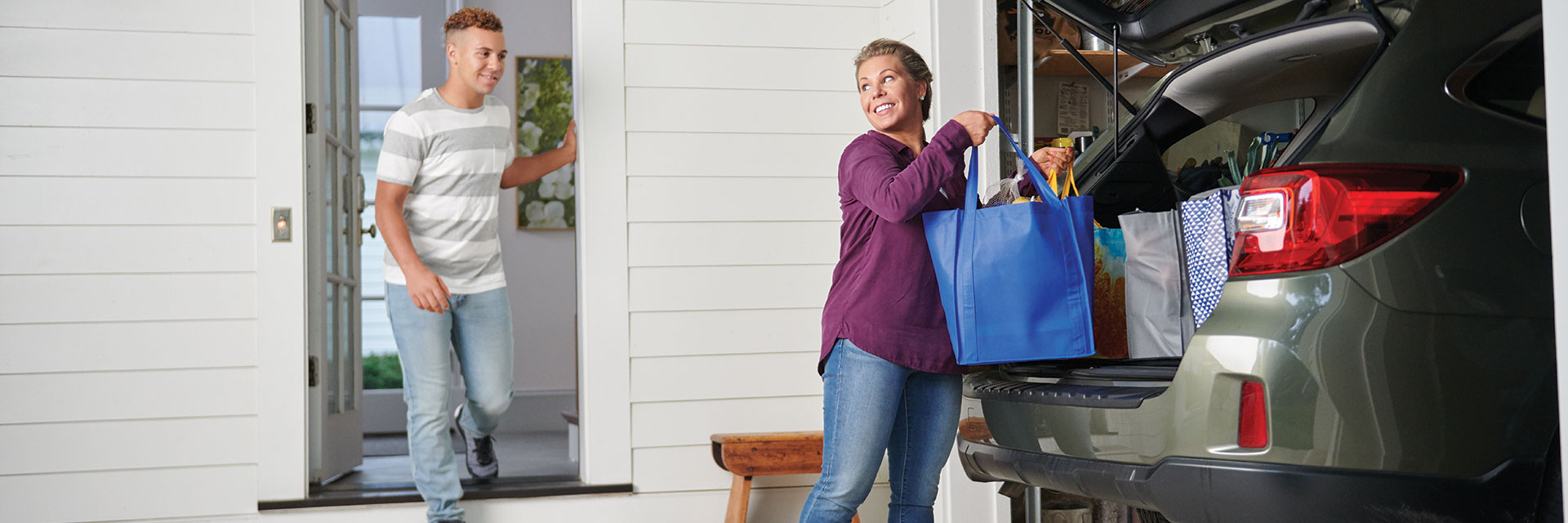 Mother and son unloading car