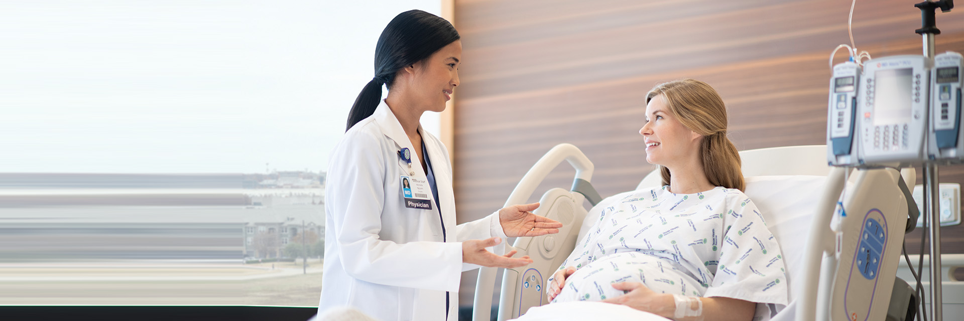 Pregnant woman talking to doctor