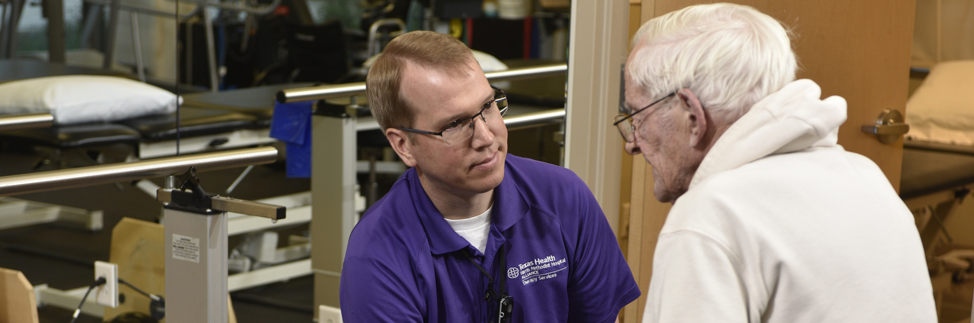 Elderly man getting balance therapy