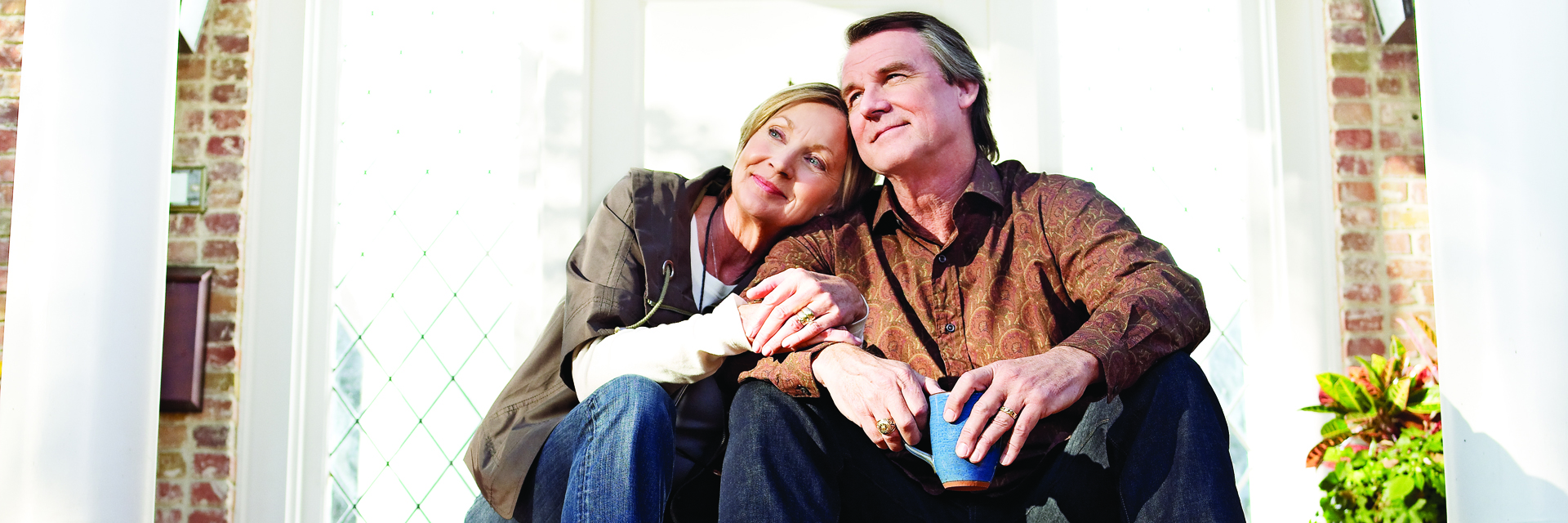 Couple sitting outside on front porch