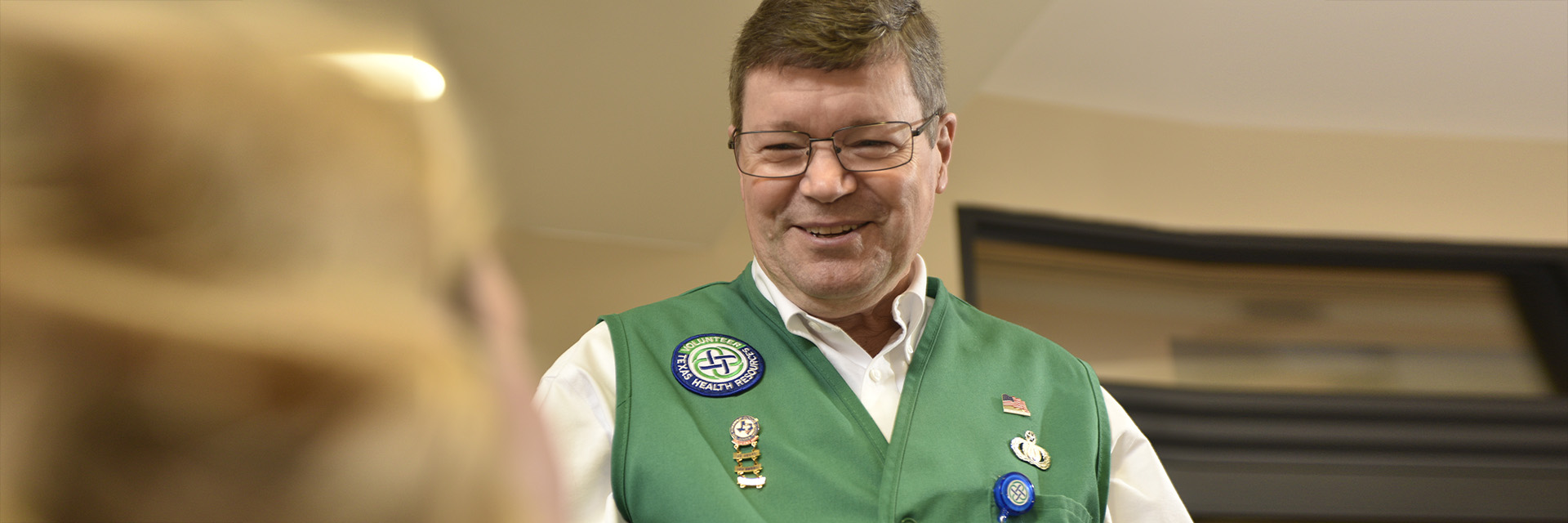 Male Volunteer Smiling at Patient