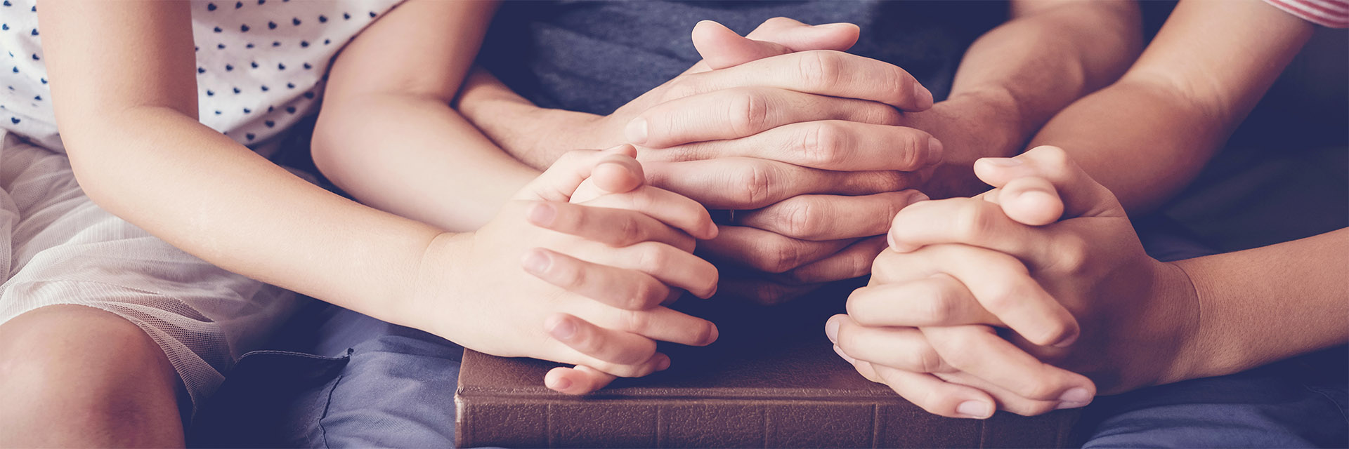 Hands clasped together in prayer