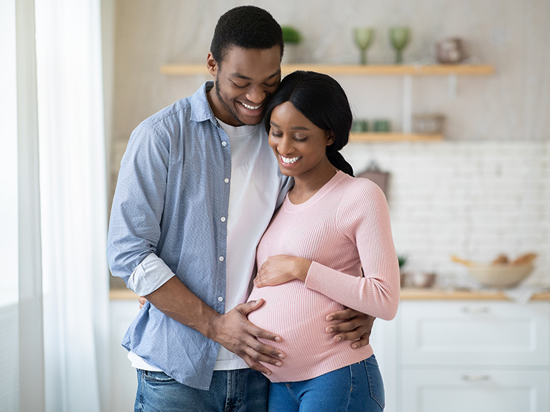 Pregnant couple in kitchen