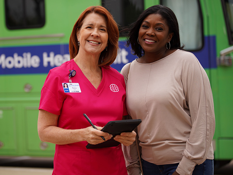 Provider and woman near mobile unit