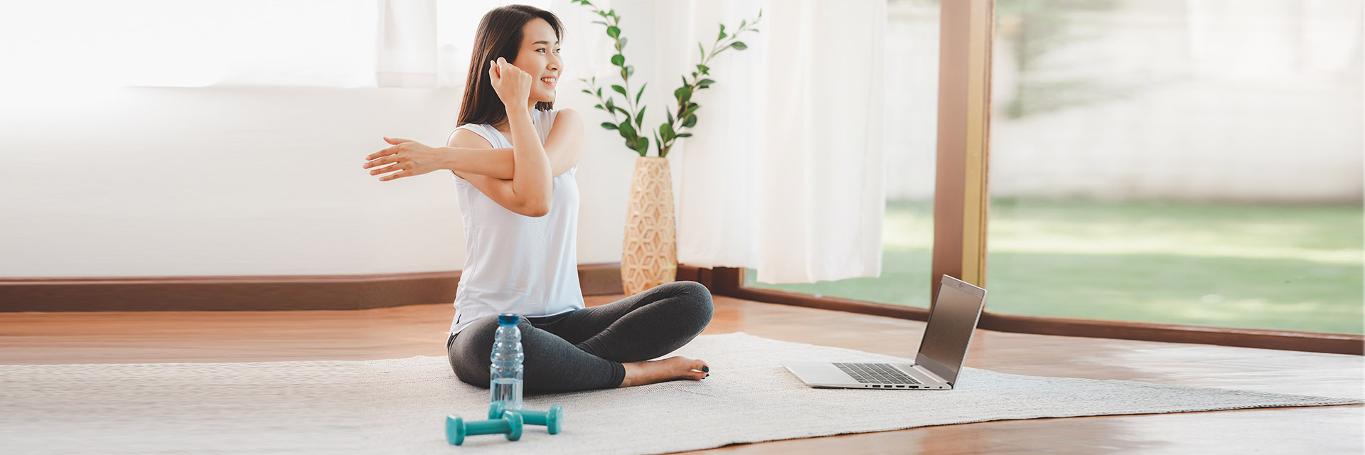 Woman doing yoga pose on the floor