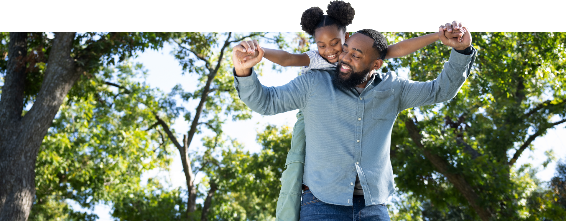 Dad carrying daughter