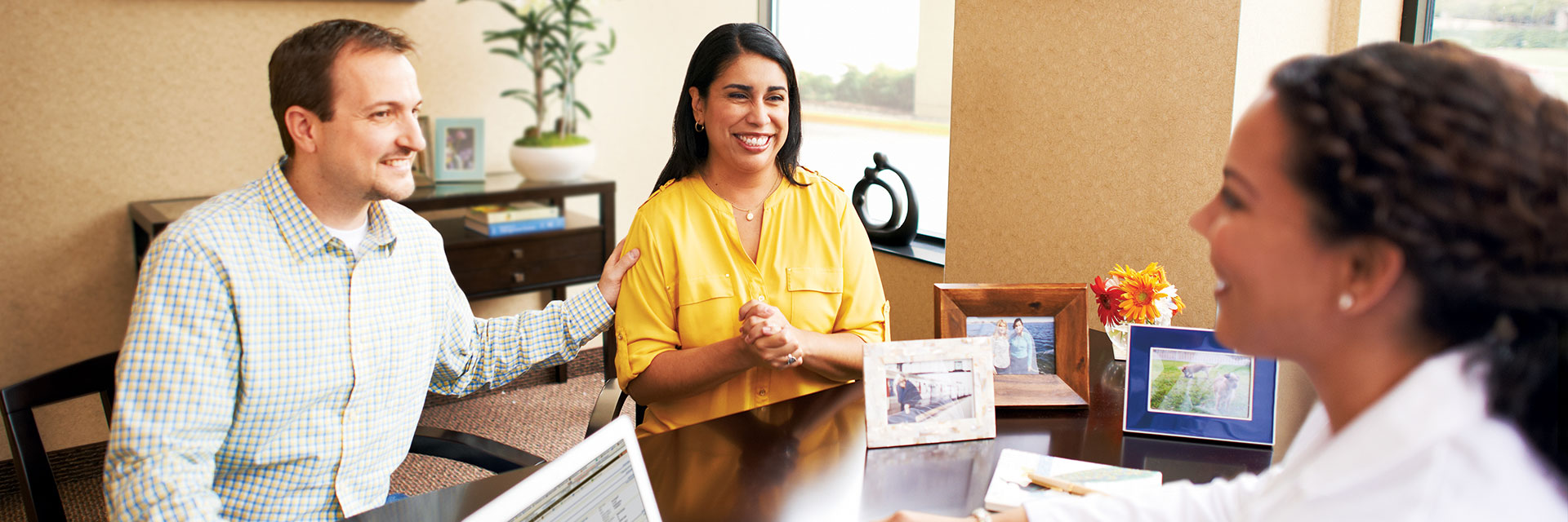 Young Couple Speaking with Provider