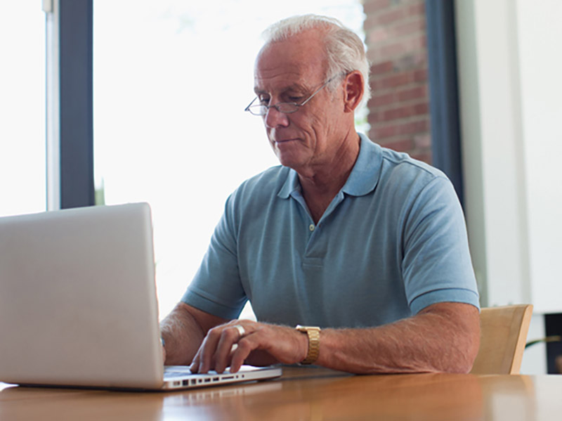 Person using a laptop at a table